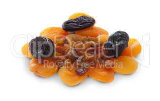 Apricots prunes and raisins on a white