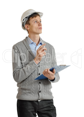 builder in a protective helmet and with a clipboard