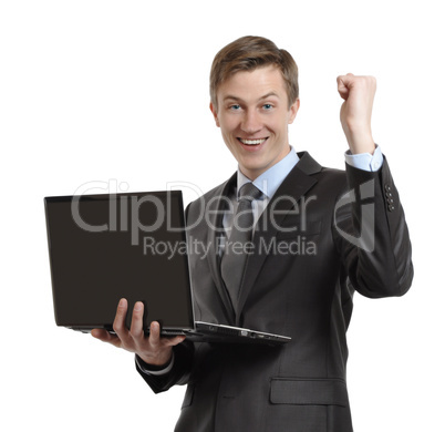 businessman with laptop celebrating winning