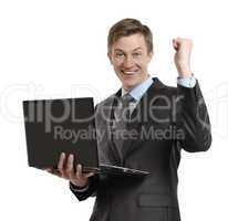 businessman with laptop celebrating winning