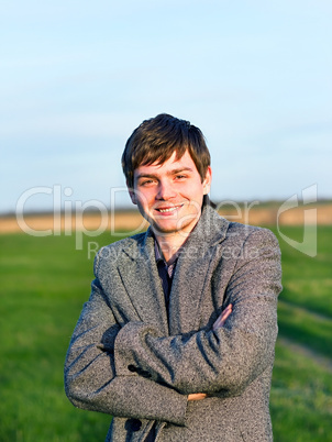 Handsome man outdoors portrait. Spring colors.