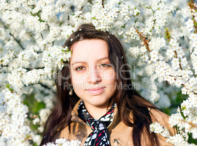 Outdoor spring portrait of young sensual pretty brunette