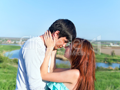 Happy young couple in the spring park