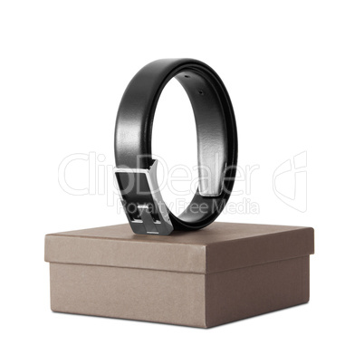 Man's black belt on box isolated on white