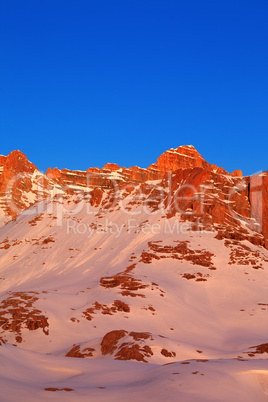 Sunrise in snow mountains