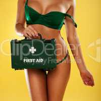 sexy busty woman with a first aid kit