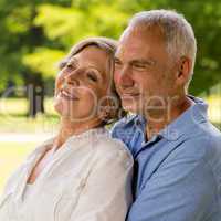Senior couple embracing in nature