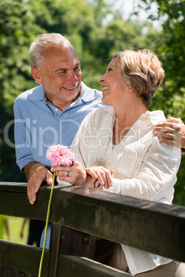 Romantic senior couple laughing outdoors