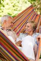 Happy elderly couple in hammock