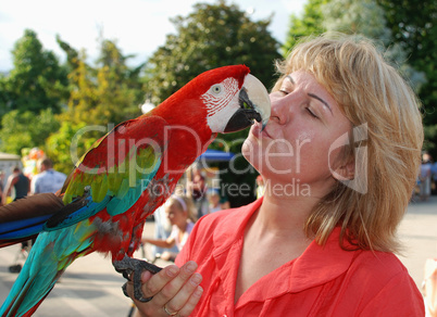 woman with red macaw