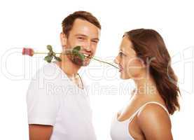 husband offering a rose to his happy wife