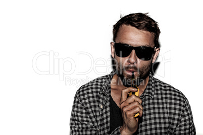 man smoking e-cigarette wearing sunglasses