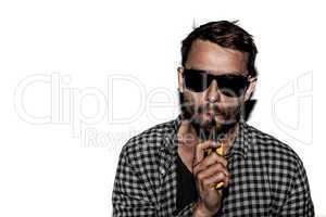 man smoking e-cigarette wearing sunglasses