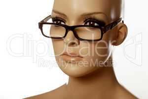 mannequin wearing spec reading glasses on white