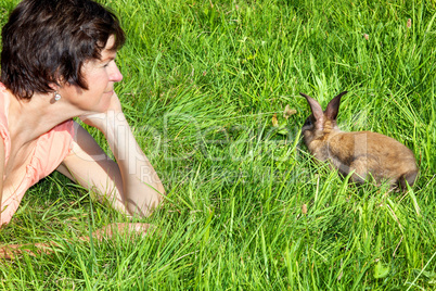Woman watching little rabbits