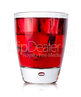 Red drink with ice cubes in a glass