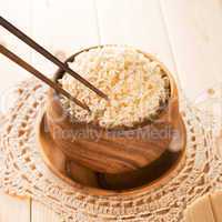 Eating rice with chopsticks.