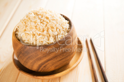 Cooked organic basmati brown rice with chopsticks