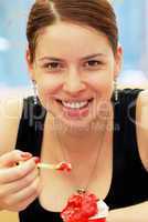 Young woman portrait eating ice-cream