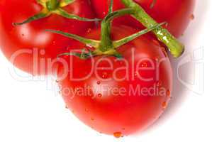 Ripe tomato with water drops. Close-up view.