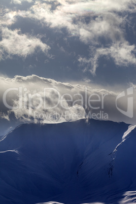 mountains in evening and sunlight clouds