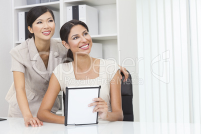 Asian Chinese & Hispanic Businesswomen Using Tablet Computer