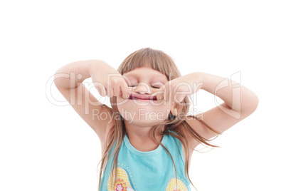 Little girl making funny face, isolated on white