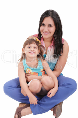 mother and daughter sitting on the floor and hugging each other