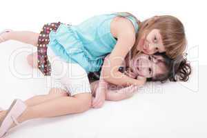 two kids play together, isolated on white background