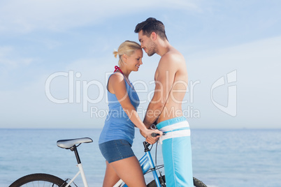 Cute couple together with their bicycles