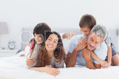 Cute family lying together Cute family lying together