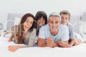 Happy family lying together