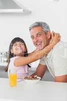 Smiling little girl hugging her dad