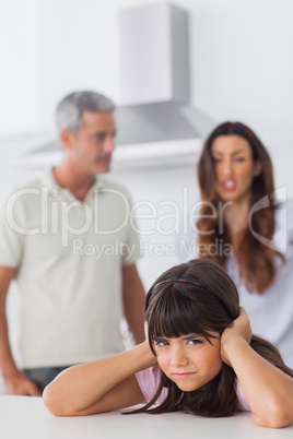 Angry couple having dispute in front of their daughter