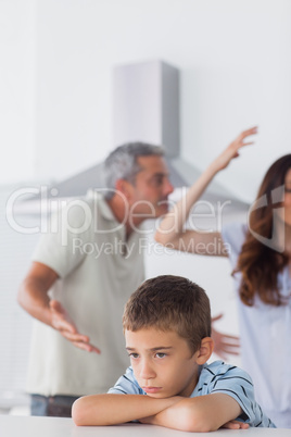 Couple having dispute in front of their upset son