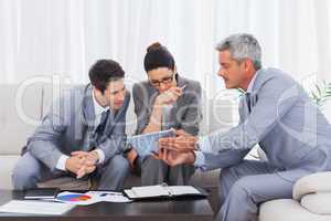 Business people working together on sofa