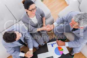 Smiling business shaking hands during meeting