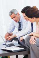 Business people working with their laptop on sofa