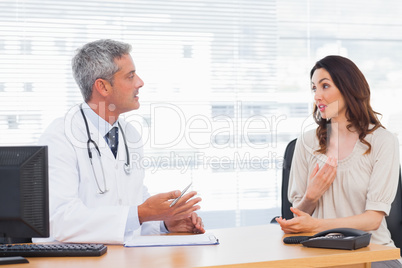 Patient talking with her doctor about illness