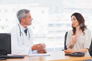 Patient talking with her doctor about illness