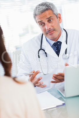 Doctor explaining a sickness to his patient