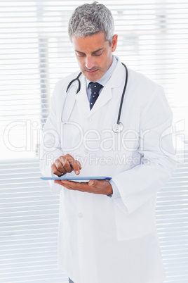 Doctor using tablet pc