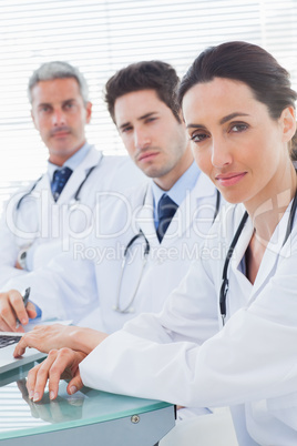 Doctors looking at camera