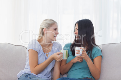 Friends drinking coffee and laughing