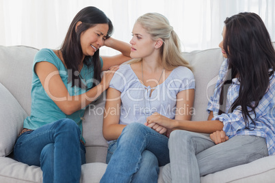Friends listening to crying woman