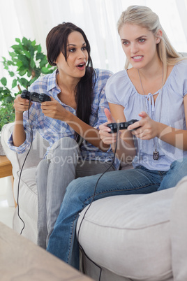 Young friends playing video games and having fun