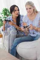 Young friends playing video games and having fun