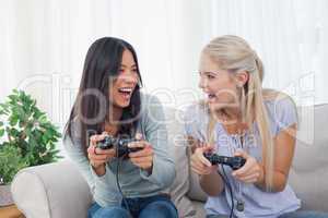 Silly friends playing video games and laughing