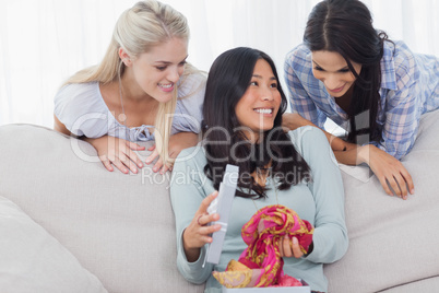 Woman looking thankful for present from her friends