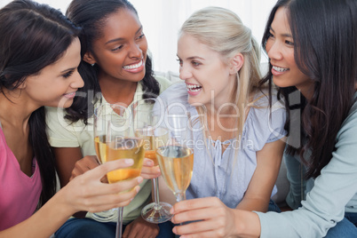 Friends toasting with white wine